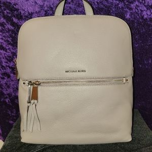 NWT - Michael Kors Pearl Grey Medium Slim Rhea zip around  Backpack. 